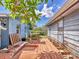 Backyard deck on an older home featuring wood construction, greenery, and blue skies at 2818 Olympic St, Sarasota, FL 34231