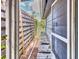 Backyard access way, featuring a damaged path leading to a fenced yard at 2818 Olympic St, Sarasota, FL 34231