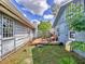 The backyard has an elevated deck between a two story home and an outbuilding at 2818 Olympic St, Sarasota, FL 34231