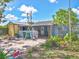 Cozy backyard featuring a lattice fence, lush plants, and a shed, ideal for outdoor relaxation at 2818 Olympic St, Sarasota, FL 34231