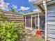 The backyard has access to a screen enclosed patio area and a wood fence at 2818 Olympic St, Sarasota, FL 34231