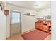 Finished basement with a workbench, cabinets, and a work area, perfect for a home office or hobby space at 2818 Olympic St, Sarasota, FL 34231