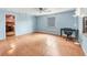 The light blue bedroom features a ceiling fan and window at 2818 Olympic St, Sarasota, FL 34231