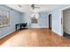 This light blue bedroom has a ceiling fan, closet, and workspace at 2818 Olympic St, Sarasota, FL 34231
