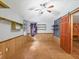 Unfurnished room featuring paneled walls, a ceiling fan, and natural light at 2818 Olympic St, Sarasota, FL 34231