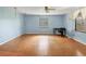 A nice bedroom features a ceiling fan, window, and a workspace at 2818 Olympic St, Sarasota, FL 34231