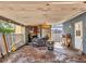 An alternate view of the carport with concrete flooring, ideal for parking and storage at 2818 Olympic St, Sarasota, FL 34231