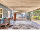 Exterior carport view with concrete flooring, perfect for parking or outdoor projects with easy access to adjacent backyard at 2818 Olympic St, Sarasota, FL 34231