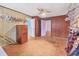Walk-in closet with wood paneling, shelving, hanging racks, and an attached storage cabinet at 2818 Olympic St, Sarasota, FL 34231
