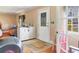 Entryway with stained glass door, and adjacent partially open doorway with natural light at 2818 Olympic St, Sarasota, FL 34231