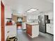 Kitchen with white cabinets, stainless steel appliances, and a center island at 2818 Olympic St, Sarasota, FL 34231