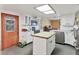 Kitchen with white cabinets, black appliances, and a center island at 2818 Olympic St, Sarasota, FL 34231