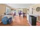 Living room with hardwood floors leading to open doorway at 2818 Olympic St, Sarasota, FL 34231