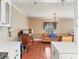 Living room with wood floors, cream-colored walls, and a large window at 2818 Olympic St, Sarasota, FL 34231