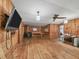Spacious living room with wood paneling and a cozy wood-burning stove at 2818 Olympic St, Sarasota, FL 34231
