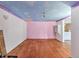 A spacious room with hardwood floors and colorful accents at 2818 Olympic St, Sarasota, FL 34231