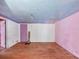 Empty room with hardwood floors and colorful accents at 2818 Olympic St, Sarasota, FL 34231
