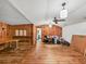 Wood paneled room with wood floors and a ceiling fan at 2818 Olympic St, Sarasota, FL 34231