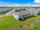 An aerial view showcasing the townhome's architecture and community layout nestled within lush green landscaping at 2824 Pearly Banks Dr, Bradenton, FL 34208