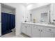 Bathroom features a dual sink vanity with modern fixtures and a private toilet area at 2824 Pearly Banks Dr, Bradenton, FL 34208