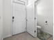Bright foyer features tile flooring, a white front door, and a half bath for guests at 2824 Pearly Banks Dr, Bradenton, FL 34208