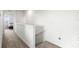Upstairs hallway with a carpet floor and bedroom view at 2824 Pearly Banks Dr, Bradenton, FL 34208