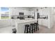 Spacious kitchen with granite counters, stainless steel appliances, and a breakfast bar island at 2824 Pearly Banks Dr, Bradenton, FL 34208