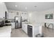 Modern kitchen with stainless steel appliances, a granite island, and ample cabinet space at 2824 Pearly Banks Dr, Bradenton, FL 34208