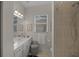 Cozy bathroom with tiled shower, vanity with wall mirror, and coordinated decor at 2937 Seasons Blvd, Sarasota, FL 34240