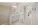 Well-lit bathroom with a walk-in shower, vanity, and neutral color scheme at 2937 Seasons Blvd, Sarasota, FL 34240