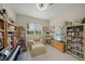 Inviting room features bookshelves, piano, and study area with natural light at 2937 Seasons Blvd, Sarasota, FL 34240