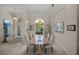 Elegant dining room boasts natural light from a large window and seating for six at 2937 Seasons Blvd, Sarasota, FL 34240
