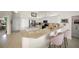 Stylish kitchen with a breakfast bar, white cabinetry, and stainless steel appliances at 2937 Seasons Blvd, Sarasota, FL 34240