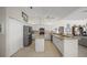 Bright, updated kitchen with white cabinets, stainless steel appliances, and open layout at 2937 Seasons Blvd, Sarasota, FL 34240