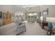 Inviting living room with plush seating, neutral decor, and seamless indoor-outdoor flow at 2937 Seasons Blvd, Sarasota, FL 34240