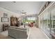 Spacious living room filled with natural light and views of the lush backyard at 2937 Seasons Blvd, Sarasota, FL 34240