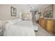 Calm main bedroom with a ceiling fan, dresser, and soothing decor at 2937 Seasons Blvd, Sarasota, FL 34240