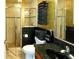 Bathroom featuring a glass-enclosed shower and granite countertop at 2962 Wilderness E Blvd, Parrish, FL 34219