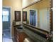 Bathroom featuring a granite countertop, large mirror, and white cabinets at 2962 Wilderness E Blvd, Parrish, FL 34219