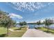 Community boat ramp featuring serene water views and lush greenery, for easy access to boating activities at 2962 Wilderness E Blvd, Parrish, FL 34219