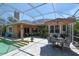 Outdoor patio with poolside dining and seating areas at 2962 Wilderness E Blvd, Parrish, FL 34219