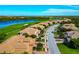 Beautiful aerial view of homes in a lakeside community with a golf course and well-manicured lawns at 318 Winding Brook Ln # 104, Bradenton, FL 34212