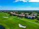 Beautiful golf course community featuring condos with well-maintained lawns and mature trees at 318 Winding Brook Ln # 104, Bradenton, FL 34212