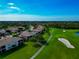 Beautiful golf course community featuring condos with well-maintained lawns and mature trees at 318 Winding Brook Ln # 104, Bradenton, FL 34212