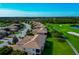 Community view of lush landscaping, golf course, and residences at 318 Winding Brook Ln # 104, Bradenton, FL 34212