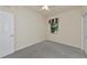Cozy bedroom with neutral walls, ceiling fan, closet, and carpeted floor at 318 Winding Brook Ln # 104, Bradenton, FL 34212