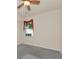 Cozy bedroom with a ceiling fan, carpeted floor and window letting in ample light at 318 Winding Brook Ln # 104, Bradenton, FL 34212