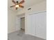 Bedroom featuring neutral walls, ceiling fan, closet, and carpeted floor at 318 Winding Brook Ln # 104, Bradenton, FL 34212