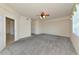 Spacious carpeted bedroom features ceiling fan and window, offering plenty of natural light at 318 Winding Brook Ln # 104, Bradenton, FL 34212