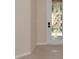 Entryway with a decorative glass front door, neutral walls, and tile flooring at 318 Winding Brook Ln # 104, Bradenton, FL 34212